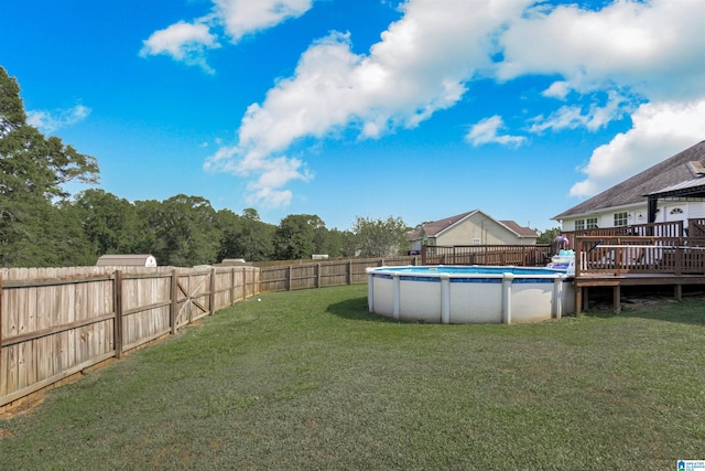 view of yard featuring a swimming pool side deck