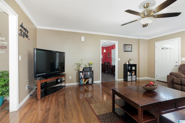 living room with ceiling fan, ornamental molding, and hardwood / wood-style flooring