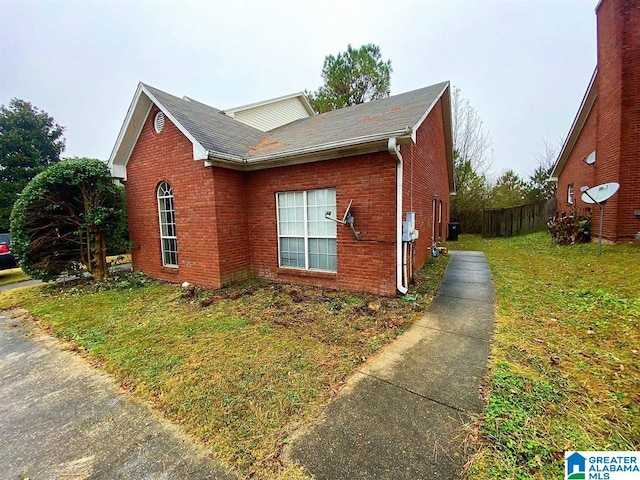 view of home's exterior featuring a lawn