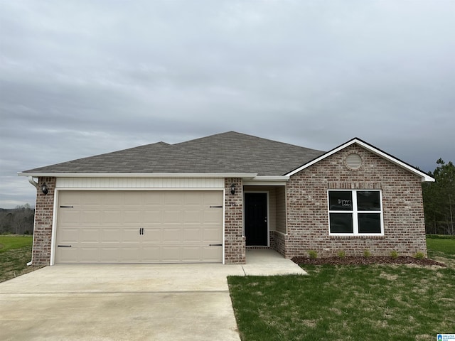 ranch-style house featuring a front lawn and a garage