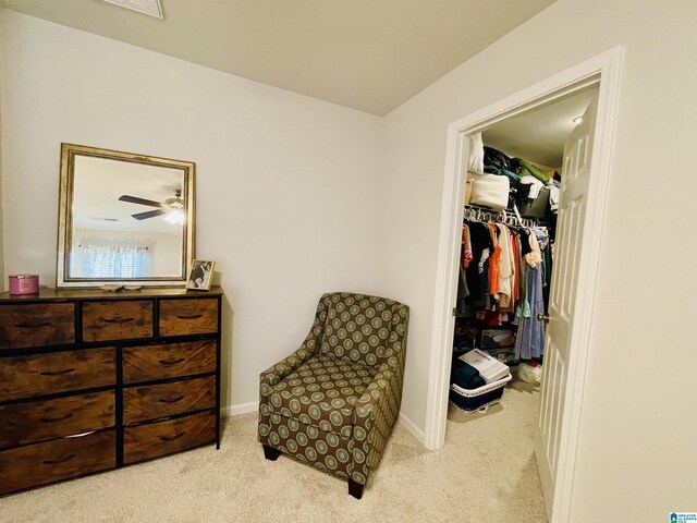 bedroom with light carpet and ceiling fan