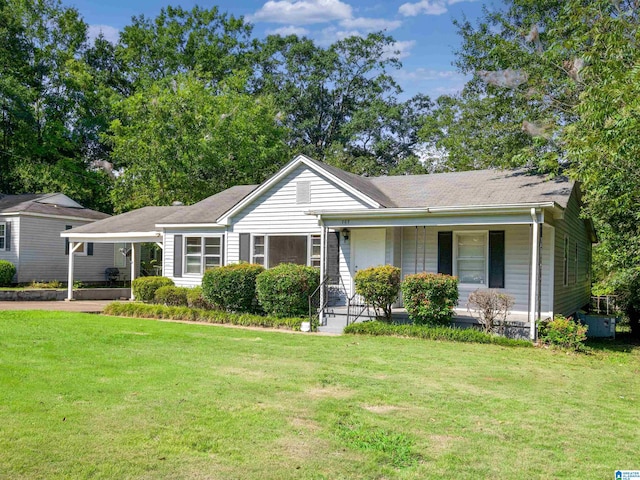 ranch-style home with a front lawn and a porch