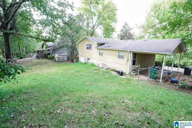 back of house with a yard