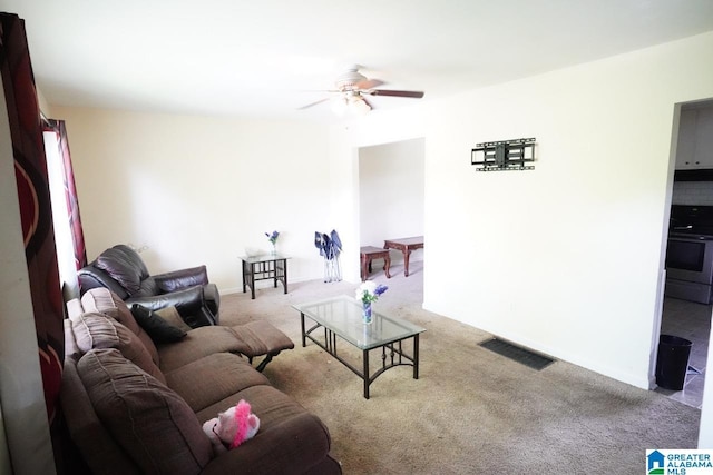 carpeted living room featuring ceiling fan