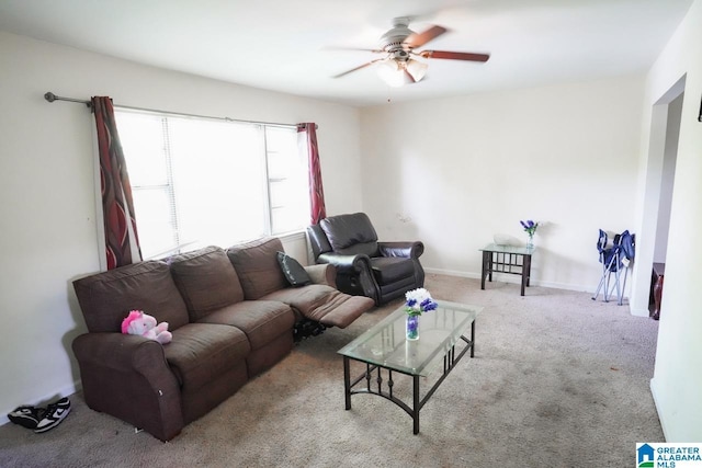 living room with light carpet and ceiling fan