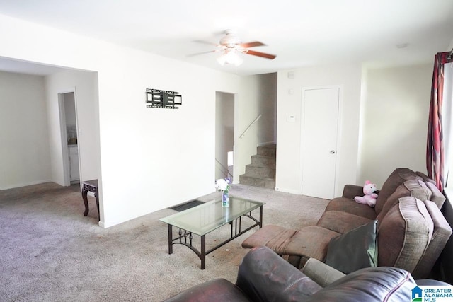 carpeted living room featuring ceiling fan