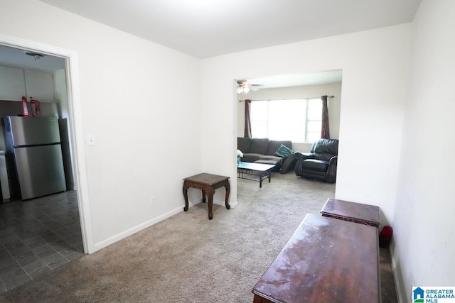 living room with carpet floors and ceiling fan