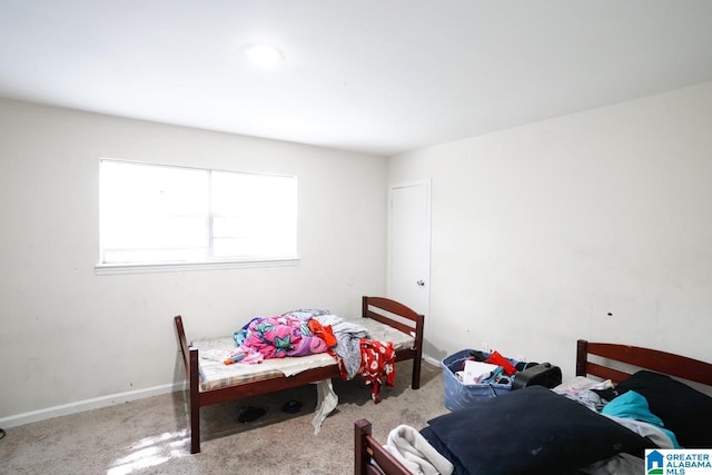 bedroom featuring light colored carpet