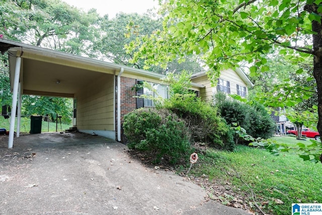 view of home's exterior featuring a carport