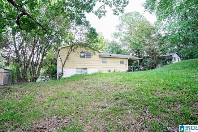 rear view of house with a yard