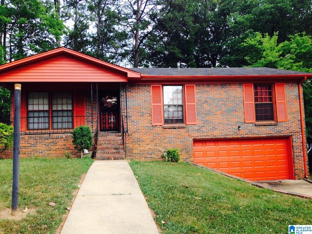 view of front of home with a garage, a front yard, and covered porch