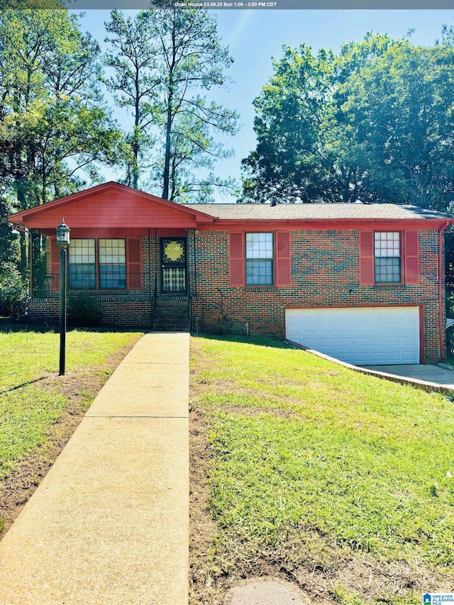 view of front of property featuring a garage, brick siding, and a front lawn