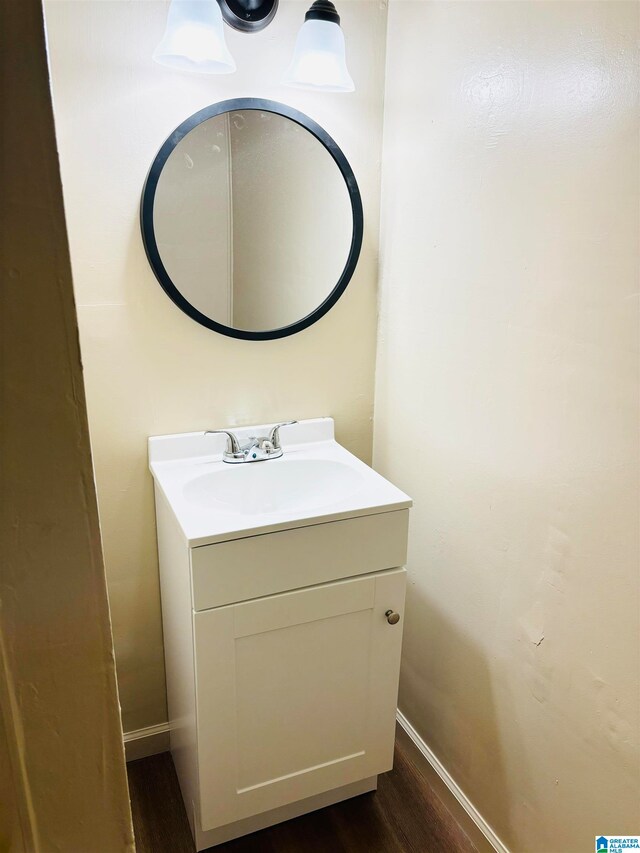 bathroom featuring hardwood / wood-style floors and vanity