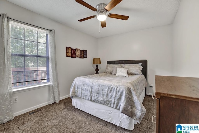 bedroom with ceiling fan and carpet flooring