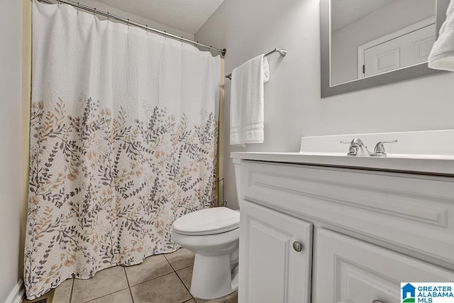 bathroom with tile patterned flooring, a shower with shower curtain, vanity, and toilet