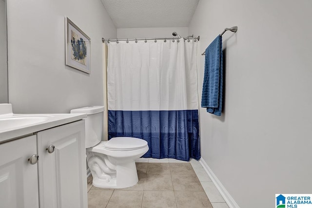 bathroom with a shower with curtain, toilet, tile patterned flooring, vanity, and a textured ceiling