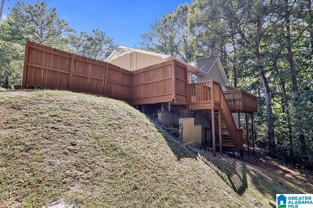 view of home's exterior with a wooden deck