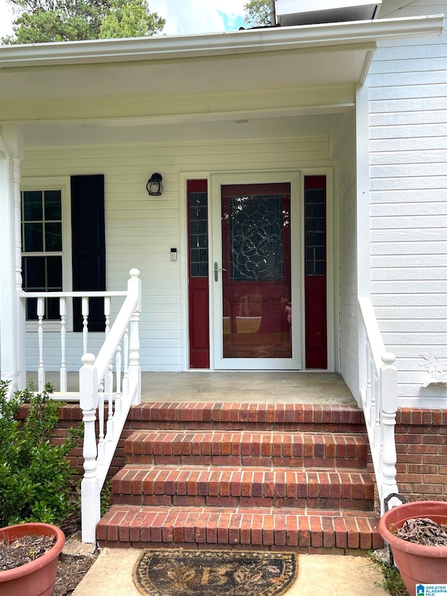 property entrance featuring a porch