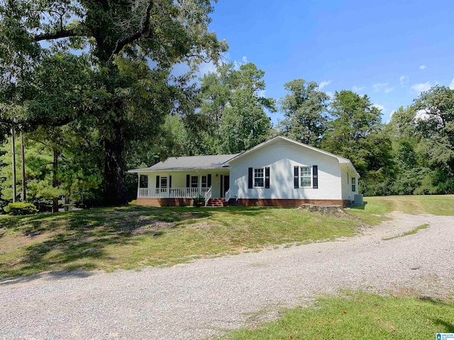 single story home with a front yard and a porch