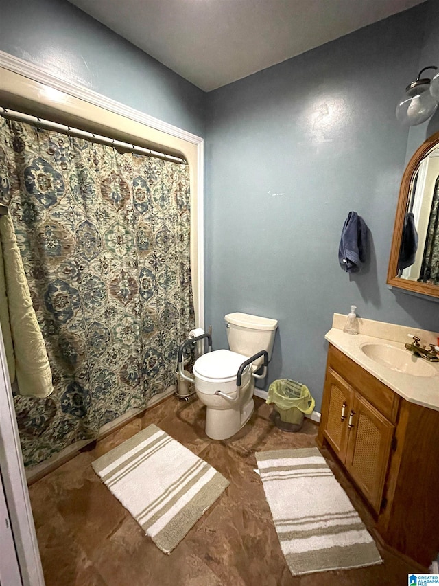 bathroom with tile patterned flooring, toilet, and vanity