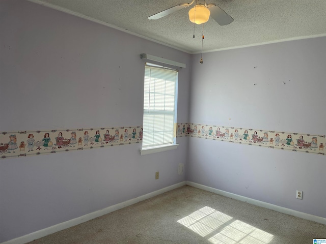 unfurnished room featuring a textured ceiling, ceiling fan, and carpet