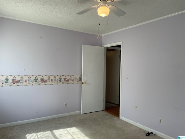 unfurnished room featuring ceiling fan, carpet flooring, and a textured ceiling