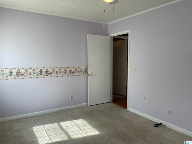 unfurnished room with carpet floors and a textured ceiling