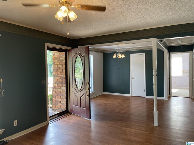 foyer with hardwood / wood-style flooring, plenty of natural light, a textured ceiling, and ceiling fan