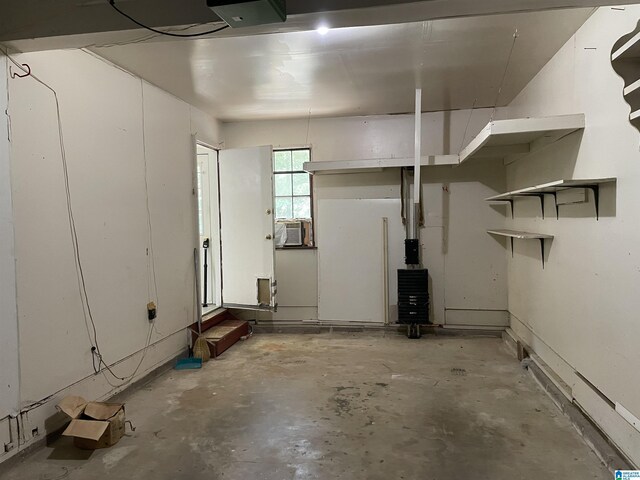 garage featuring a garage door opener and cooling unit