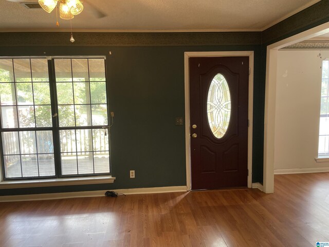 entrance foyer with hardwood / wood-style floors and ceiling fan