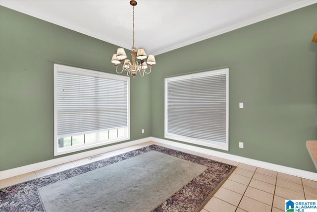 unfurnished dining area featuring light tile patterned floors, crown molding, and a notable chandelier