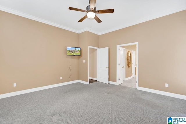 unfurnished bedroom with ceiling fan, connected bathroom, crown molding, and light colored carpet