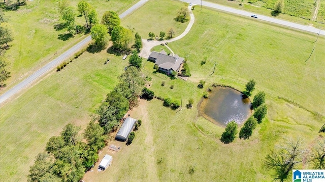 aerial view with a water view and a rural view