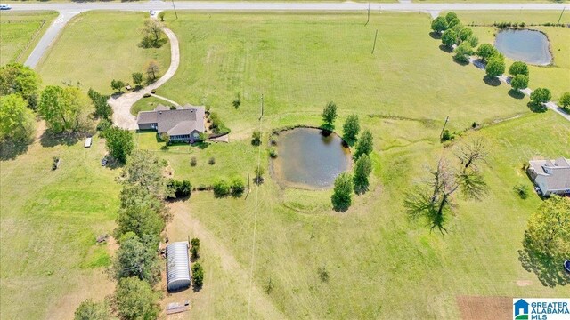 drone / aerial view with a rural view and a water view