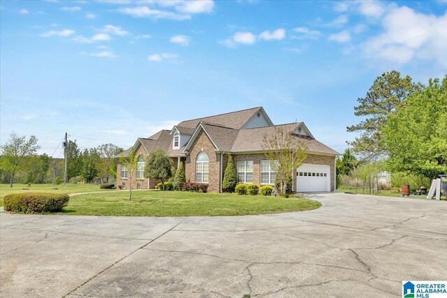 view of front facade with a garage and a front lawn