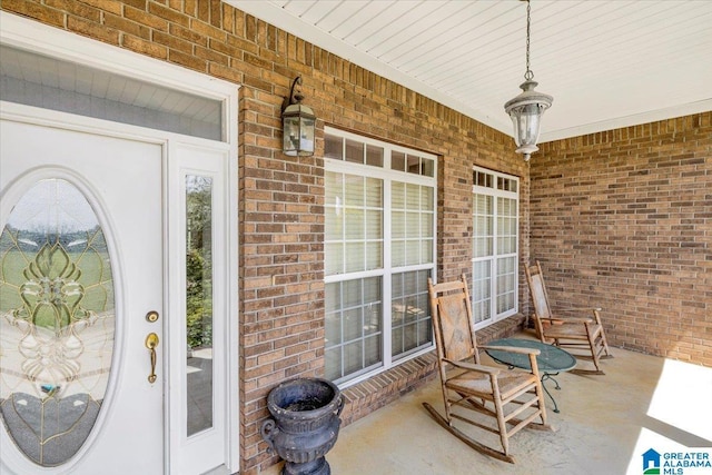 doorway to property featuring covered porch