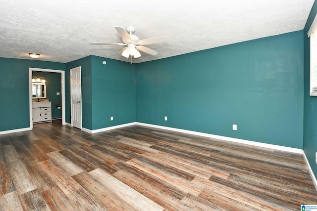 spare room featuring ceiling fan, a textured ceiling, and hardwood / wood-style floors