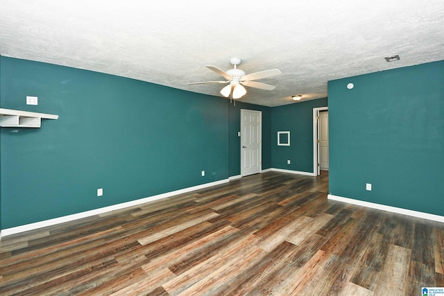 unfurnished room featuring a textured ceiling, ceiling fan, and hardwood / wood-style flooring