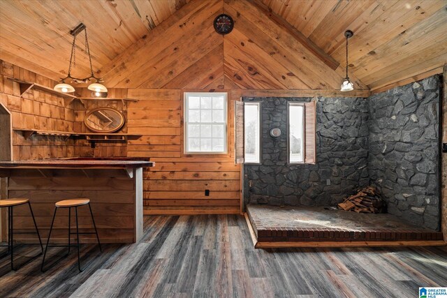 bathroom with hardwood / wood-style floors, a bathing tub, a textured ceiling, vanity, and toilet