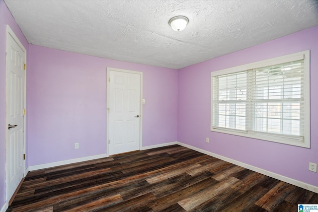 bathroom with a textured ceiling, hardwood / wood-style flooring, shower with separate bathtub, and vanity