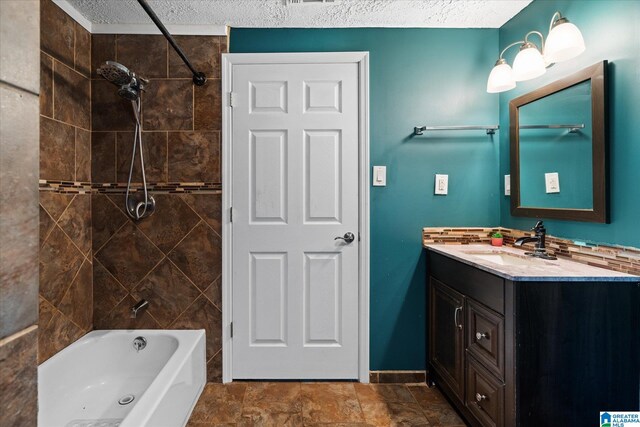 entrance foyer featuring light tile patterned flooring and a textured ceiling