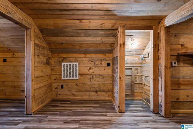 stairs with wooden walls and electric panel