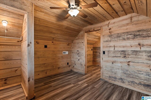 bonus room featuring wood-type flooring, vaulted ceiling, wooden walls, ceiling fan, and wood ceiling