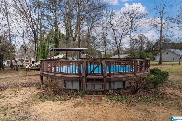 view of yard featuring an outdoor structure and french doors