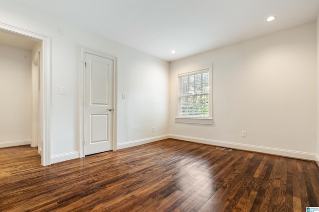 2701 11th Ave Unit 101, Birmingham, AL 35205 - empty room featuring dark wood finished floors, baseboards, and recessed lighting