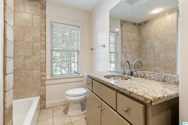 bathroom with tile patterned floors, tile walls, vanity, and toilet