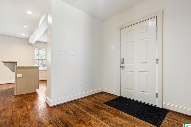 entryway with dark hardwood / wood-style floors