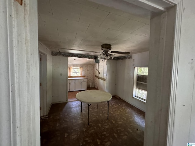 interior space featuring a ceiling fan