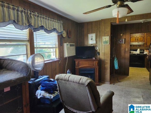 tiled living room with wooden walls, ceiling fan, and a wall mounted air conditioner