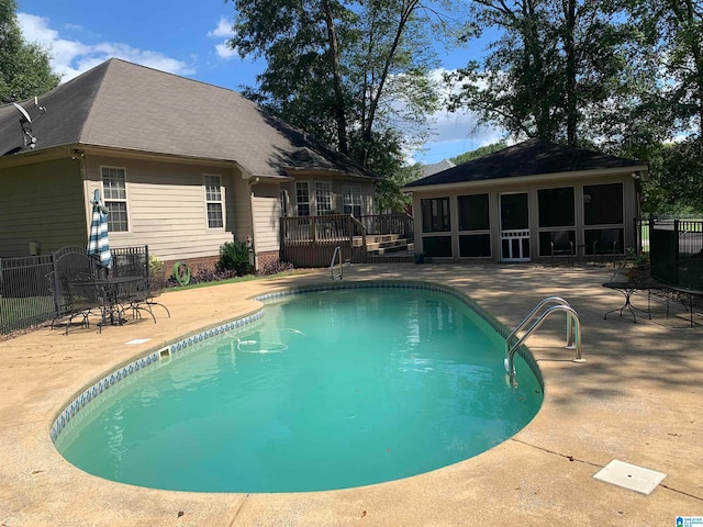 view of pool with a deck